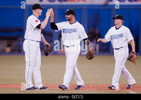 Apr. 15, 2010 - Toronto, Ontario, Canada - 15 April 2010 Toronto, Ontario:   Toronto Blue Jays first baseman Lyle Overbay #35 (left) celebrates with teammates Toronto Blue Jays shortstop Alex Gonzalez #11 (centre) and Toronto Blue Jays left fielder Travis Snider #45 in their victory over the Chicago White Sox by a score of 7-3, at Rogers Centre in Toronto, Ontario. (Credit Image: © Stock Photo