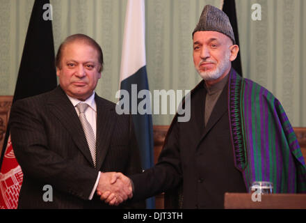 Kabul, Afghanistan. 30th Nov, 2013. Afghan President Hamid Karzai (R) shakes hands with Pakistani Prime Minister Nawaz Sharif during a joint press conference in Kabul, Afghanistan, on Nov. 30, 2013. A peaceful Afghanistan is for the benefit of Pakistan, said Pakistani Prime Minister Nawaz Sharif who visited Afghan capital Kabul on Saturday and held a meeting with President Hamid Karzai. © Ahmad Massoud/Xinhua/Alamy Live News Stock Photo