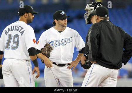 Apr. 16, 2010 - Toronto, Ontario, Canada - 16 April 2010: Toronto Blue Jays starting pitcher Shaun Marcum (28), Jose Bautista (19), John Buck (14) and pitching coach Bruce Walton talk things over during a game against the Los Angeles Angels at the Rogers Centre in Toronto, Ontario. (Credit Image: © Adrian Gauthier/Southcreek Global/ZUMApress.com) Stock Photo