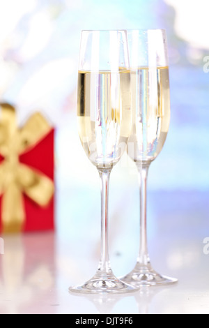 Pair glasses of champagne and present box, closeup Stock Photo
