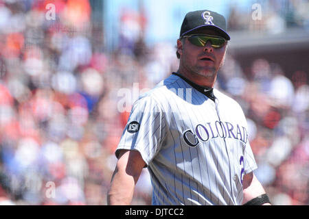 Colorado Rockies' Jason Giambi (23) is congratulated by teammate Todd  Helton (17) after hitting a two-run home run in off of Florida Marlins' Leo  Nunez during the ninth inning of a baseball