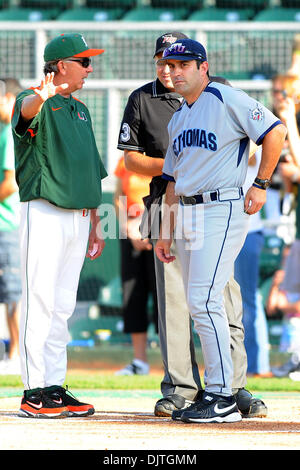 Miami Hurricanes head coach Jim Morris (3) goes over ground rules with St. Thomas University Bobcats Head Coach Jorge Perez (28)..The 14th ranked Miami Hurricanes defeated the St. Thomas University Bobcats 9-6 at Alex Rodriguez Park in Coral Gables, Florida. (Credit Image: © Ron Hurst/Southcreek Global/ZUMApress.com) Stock Photo