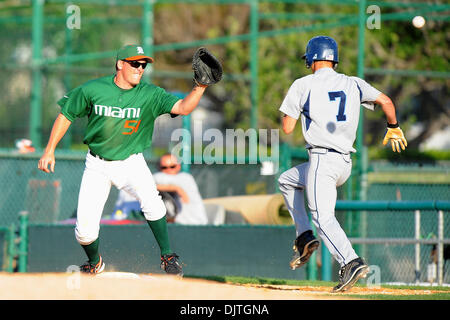 Miami Hurricanes 1B Ryan Perry (51) waits for throw to make play on St. Thomas University Bobcats INF Lance Larimer (7). The 14th ranked Miami Hurricanes defeated the St. Thomas University Bobcats 9-6 at Alex Rodriguez Park in Coral Gables, Florida. (Credit Image: © Ron Hurst/Southcreek Global/ZUMApress.com) Stock Photo