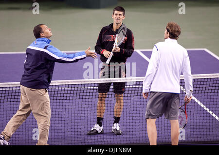 Mardy FISH (USA) blue shirt and Novak DJOKOVIC (SRB) black shirt  - at the 2010 BNP Paribas Open held at the Indian Wells Tennis Garden in Indian Wells, California. Djokovic (SRB) defeated Fish (USA) 6-1, 0-6, 6-2. (Credit Image: © Gerry Maceda/Southcreek Global/ZUMApress.com) Stock Photo