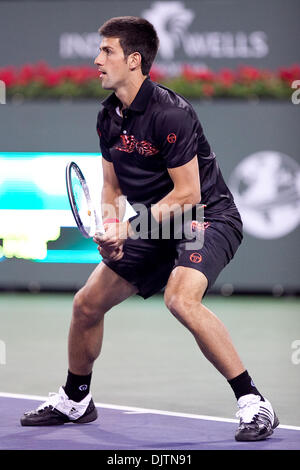 Mardy FISH (USA) blue shirt and Novak DJOKOVIC (SRB) black shirt  - at the 2010 BNP Paribas Open held at the Indian Wells Tennis Garden in Indian Wells, California. Djokovic (SRB) defeated Fish (USA) 6-1, 0-6, 6-2. (Credit Image: © Gerry Maceda/Southcreek Global/ZUMApress.com) Stock Photo