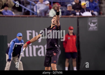 Mardy FISH (USA) blue shirt and Novak DJOKOVIC (SRB) black shirt  - at the 2010 BNP Paribas Open held at the Indian Wells Tennis Garden in Indian Wells, California. Djokovic (SRB) defeated Fish (USA) 6-1, 0-6, 6-2. (Credit Image: © Gerry Maceda/Southcreek Global/ZUMApress.com) Stock Photo