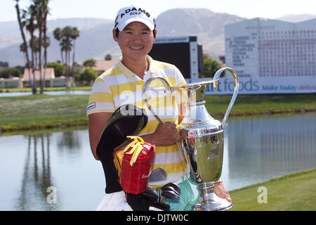 Yani Tseng (right) pictured with her trophy after winning the championship of the  39th Kraft Nabisco Championship held at Mission Hills Country Club in Rancho Mirage, California. (Credit Image: © Gerry Maceda/Southcreek Global/ZUMApress.com) Stock Photo