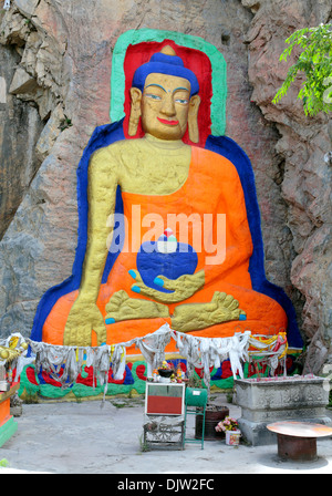 Stone carving of Buddha Shakyamuni, near Drolma Lhakhang monastery, Lhasa, Tibet, China Stock Photo