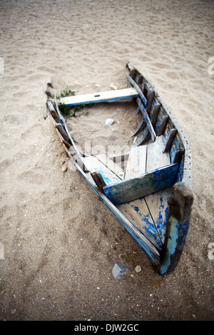 Color picture of an abandoned boat stuck in sand Stock Photo