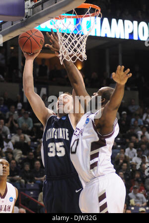 Utah State's forward Nate Bendall (35) puts up a shot over Texas A&M forward Bryan Davis during the first half of the NCAA  basketball game held at the Spokane Arena in Spokane WA. This was during the first round of the NCAA Tournament. James Snook / Southcreek Global (Credit Image: © James Snook/Southcreek Global/ZUMApress.com) Stock Photo