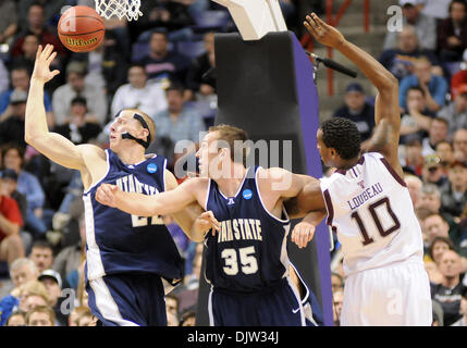 Texas A&M forward David Loubeau (10) fights for the lose ball with Utah State's forward Nate Bendall (35) and Brady Jardine during the second half of the NCAA  basketball game held at the Spokane Arena in Spokane WA. This was during the first round of the NCAA Tournament. James Snook / Southcreek Global (Credit Image: © James Snook/Southcreek Global/ZUMApress.com) Stock Photo