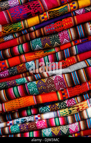 Local carpets made of llama and alpaca wool for sale at the market, Cuzco, Peru. Stock Photo