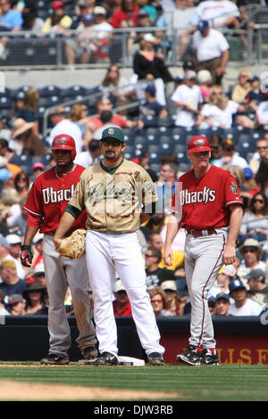 San Diego Padres first baseman Adrian Gonzalez, right, and his brother and  fellow teammate third baseman Edgar Gonzalez, left, during a spring  training baseball game against the Arizona Diamondbacks in Peoria, Ariz.