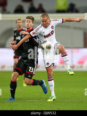 Leverkusen, Germany. 30th Nov, 2013. Nuremberg's Adam Hlousek (R) and Leverkusen's Jens Hegeler vie for the ball during the Bundesliga soccer match between Bayer o4 Leverkusen and 1. FC Nuremberg in the BayArena in Leverkusen, Germany, 30 November 2013. Photo: Rolf Vennenbernd/dpa (ATTENTION: Due to the accreditation guidelines, the DFL only permits the publication and utilisation of up to 15 pictures per match on the internet and in online media during the match.)/dpa/Alamy Live News Stock Photo