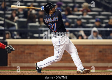 Apr. 9, 2010 - Flushing, New York, U.S - 09 April 2010: New York Mets catcher Rod Barajas (21) hits a home run in the fourth inning at Citi Field in Flushing, New York. The New York Mets defeated the Washington Nationals 8-2. .Mandatory Credit: Alan Maglaque / Southcreek Global (Credit Image: © Southcreek Global/ZUMApress.com) Stock Photo