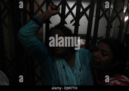 Relative of businessman Habibur Rahman, 30, cries in front of the morgue in Dhaka Medical College Hospital, after he was killed when a bus lost control after a petrol bomb attack and ran over a rickshaw carrying him, during a Bangladesh Nationalist Party (BNP)-led 72 hours nationwide protest in Dhaka November 30, 2013. At least one person was killed and five others injured in the incident, local media reported. Stock Photo