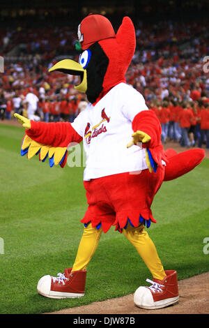 St. Louis Cardinals Fredbird girls and Fredbird the mascot launch tee shirts  into the crowd from the back of a pickup truck before the Milwaukee  Brewers-St. Louis Cardinals baseball game at Busch