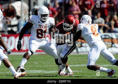 Oct. 2, 2010 - Dallas, Texas, United States of America - Oklahoma Sooners running back Trey Millard (33) is brought down by Texas Longhorns cornerback Chykie Brown (8) during the game between the University of Texas and the University of Oklahoma. The Sooners defeated the Longhorns 28-20 at the Cotton Bowl in Dallas, Texas. (Credit Image: © Jerome Miron/Southcreek Global/ZUMApress. Stock Photo