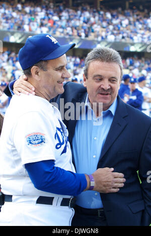 Oct. 3, 2010 - Los Angeles, California, United States of America - Los Angeles Dodgers manager Joe Torre (6) gets a hug from Los Angeles Dodgers General Manager Ned Coletti, after the Dodgers defeated the Arizona Diamondbacks 3-1 in the final game of the 2010 season, giving Torre 2326 career wins as a manager. (Credit Image: © Tony Leon/Southcreek Global/ZUMApress.com) Stock Photo