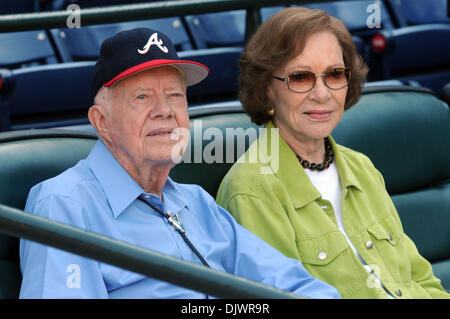 Oct. 10, 2010 - Atlanta, GEORGIA, U.S. - Former US President Jimmy Carter (L) and his wife Rosalynn watch pregame activities before the Atlanta Braves host the San Francisco Giants in game 3 of their National League Division playoff MLB baseball game in Atlanta, Georgia USA on 10 October 2010. (Credit Image: © Erik Lesser/ZUMAPRESS.com) Stock Photo