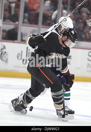 Oct 13, 2010 - Anaheim, California, U.S. - Vancouver Canucks defenseman KEVIN BIEKSA controls the puck from Anaheim Ducks left wing JASON BLAKE during the second period of an NHL hockey game at the Honda Center.  (Credit Image: © Mark Samala/ZUMApress.com) Stock Photo