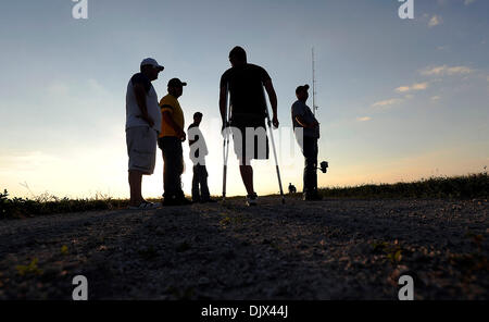 Oct. 23, 2010 - West Palm Beach, FL - Florida, USA - United States - (transmit)  fl-alligator-hunt-1023k  --   Patrick Wickens, from Orlando, talks with alligator hunters on the banks of the Stormwater Treatment Area 1-West, in Palm Beach County, as they search for alligators to catch during the Wounded Warrior Project alligator hunt, Saturday night, October 23, 2010.  Michael Laug Stock Photo