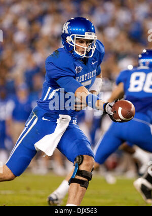 Oct. 23, 2010 - Lexington, Kentucky, United States of America - UK quarterback Mike Hartline (5) hands off for the wildcats in first half action vs Georgia from Commwealth Stadium in Lexington. Georgia leads at the half 28 to 10. (Credit Image: © Wayne Litmer/Southcreek Global/ZUMApress.com) Stock Photo