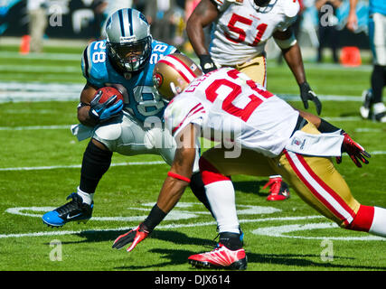 Oct. 24, 2010 - Charlotte, North Carolina, United States of America - Carolina Panthers running back Jonathan Stewart (28) looks to allude San Francisco 49ers cornerback Nate Clements (22). The Panthers and 49er's are tied 10-10 at the half at Bank of America Stadium, Charlotte NC. (Credit Image: © Mark Abbott/Southcreek Global/ZUMApress.com) Stock Photo