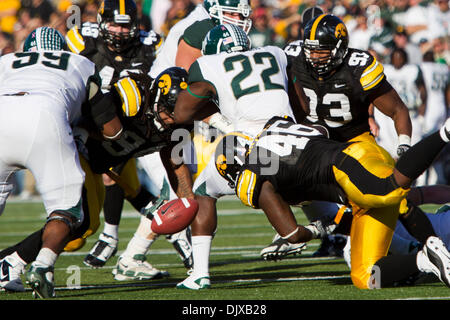 Oct. 30, 2010 - Iowa City, Iowa, United States of America - Michigan State Spartans running back Larry Caper (22) fumbles the ball after being hit from behind by Iowa Hawkeyes defensive tackle Christian Ballard (46) in an NCAA Football game between the Iowa Hawkeyes and the Michigan State Spartans on Oct, 30, 2010 at Kinnick Stadium in Iowa, City, Ia (Credit Image: © Louis Brems/So Stock Photo