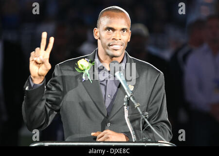 Former St. Louis Rams Isaac Bruce holds the Super Bowl trophy during  ceremonies celebrating the teams Super Bowl victory in the 1999-2000  season, at the Edward Jones Dome during half time of