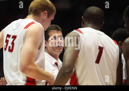 Nov. 3, 2010 - Albuquerque, New Mexico, United States of America - New Mexico head coach Steve Alford has a word with center Alex Kirk (#53) and forward Emmanuel Negedu (#1) during a time out. The Lobos didnÃ•t let up against Easter New Mexico in their first exhibition match of the season. The Lobos defeated the Grey Hounds 58-80 at The Pit in Albuquerque, New Mexico. (Credit Image Stock Photo