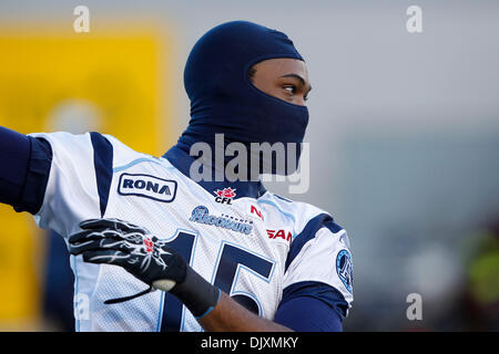 Montreal Alouettes wide receiver Reggie White Jr (84) carries the ball past  Hamilton Tiger-Cats defensive back Cariel Brooks (26) during first half  exhibition CFL football action in Hamilton on Saturday, May 28