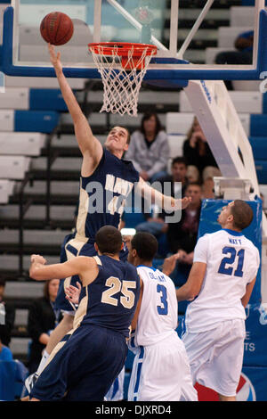 Nov. 13, 2010 - Buffalo, New York, United States of America - Navy Midshipmen center Mark Veasey (#44) makes a basket over Buffalo Bulls defenders during a game at Alumni Arena. Buffalo leads Navy at the half 42-16. (Credit Image: © Mark Konezny/Southcreek Global/ZUMApress.com) Stock Photo