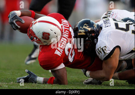 Nov. 13, 2010 - Raleigh, Carter-Finley Stadium, United States of America - NC  State quarterback Russell Wilson (#16) talks with linebacker Nate Irving  (#56) late in the game. NC State wins big