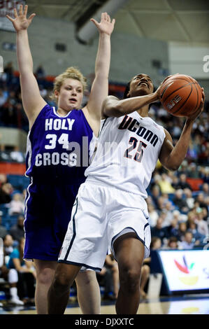 Nov. 14, 2010 - Storrs, Connecticut, United States of America - Connecticut F Michala Johnson (25,r) puts up a shot near the hoop, while Holy Cross F Christine Ganser (34) defends behind her. At the end of regulation Connecticut defeats Holy Cross 117 - 37 at Gampel Pavilion. (Credit Image: © Geoff Bolte/Southcreek Global/ZUMApress.com) Stock Photo