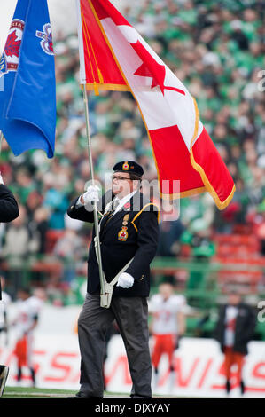 Nov. 14, 2010 - Regina, Saskatchewan, Canada - The Canadian Flag is carried onto the field before the Saskatchewan RoughrIders vs B.C. Lions CFL Western Semi Final game at Mosaic Stadium in Regina. The Saskatchewan Roughriders defeated the B.C. Lions 41-38 in overtime (Credit Image: © Derek Mortensen/Southcreek Global/ZUMApress.com) Stock Photo