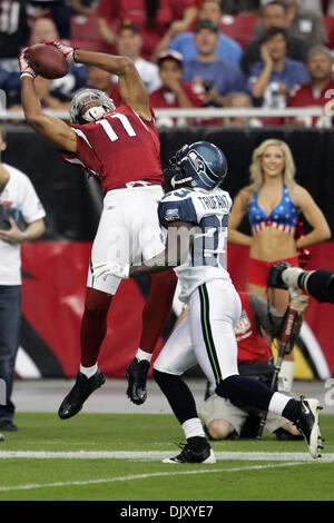 Nov. 14, 2010 - Glendale, Arizona, United States of America - Arizona Cardinals wide receiver Larry Fitzgerald (#11) jumps and makes a catch falling backwards during a game against the Seattle Seahawks at University of Phoenix Stadium in Glendale, Arizona.  The Seahawks defeated the Cardinals 36-18. (Credit Image: © Gene Lower/Southcreek Global/ZUMApress.com) Stock Photo