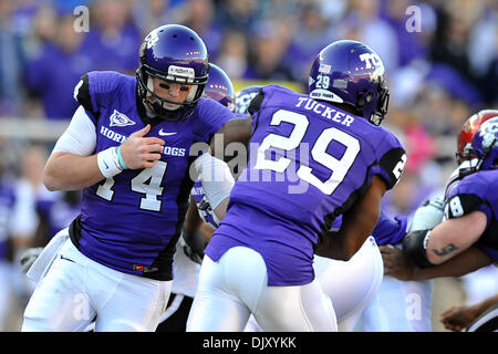 Nov. 14, 2010 - Amon G. Carter Stadium, Texas, United States of America - November 13, 2010: TCU Horned Frogs quarterback Andy Dalton (14) hands off to TCU Horned Frogs running back Matthew Tucker (29) during the game between the San Diego State University Aztecs and the Texas Christian University Horned Frogs at Amon G. Carter Stadium in Fort Worth, Texas. TCU win against over San Stock Photo