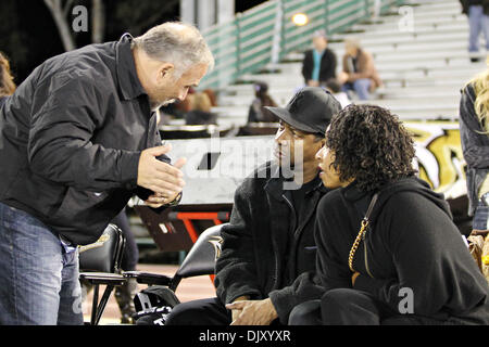 Nov. 14, 2010 - Sacramento, California, United States of America - Radio host Don Geronimo speaks with actor Denzel Washington and wife Pauletta on the Sacramento Mountain Lions sidelines. The Sacramento Mountain Lions defeated the Omaha Nighthawks 41 to 3. (Credit Image: © Chris Trim/Southcreek Global/ZUMApress.com) Stock Photo