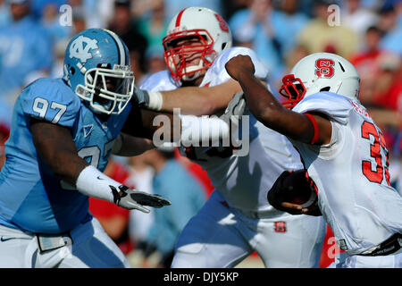 Nov. 20, 2010 - Chapel Hill, North Carolina, United States of America - North Carolina Tar Heels defensive tackle Jared McAdoo (97) rushes up the middle. North Carolina State Comes back after the half to defeat North Carolina 29-25 in the game at Kenan Stadium in Chapel Hill North Carolina. (Credit Image: © Anthony Barham/Southcreek Global/ZUMAPRESS.com) Stock Photo