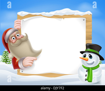 A Santa Christmas Winter Scene of Santa pointing at a winter sign with a friendly snowman Stock Photo