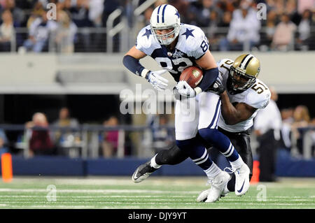 Nov. 25, 2010 - Arlington, Texas, United States of America - Dallas Cowboys tight end Jason Witten (82) makes the reception and is tackled by New Orleans Saints linebacker Jonathan Vilma (51) as the New Orleans Saints come back to defeat the Dallas Cowboys 30-27 at Cowboys Stadium in Arlington, Texas. (Credit Image: © Steven Leija/Southcreek Global/ZUMAPRESS.com) Stock Photo