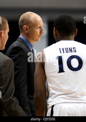 Nov. 27, 2010 - Cincinnati, Ohio, United States of America - Xavier head coach Chris Mack talks with Mark Lyons (10) during a timeout  in  action vs Wofford from the Cintas Center in Cincinnati. The Musketeers went on to win 94 to 90. (Credit Image: © Wayne Litmer/Southcreek Global/ZUMAPRESS.com) Stock Photo