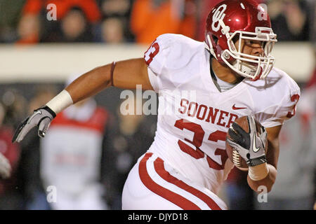 Nov. 27, 2010 - Stillwater, Oklahoma, United States of America - Trey Millard breaks away for extra yardage during game action.  Oklahoma leads Oklahoma State at the half 21-17 in the game at Boones Pickens Stadium. (Credit Image: © Spruce Derden/Southcreek Global/ZUMAPRESS.com) Stock Photo