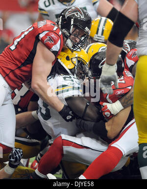 Nov. 28, 2010 - Atlanta, Georgia, U.S. - Green Bay Packers running back DIMITRI NANCE (#23) is stopped by Atlanta Falcons defensive end KROY BIERMANN (#71) and Atlanta Falcons linebacker COY WIRE (#52) at the Georgia Dome. The Falcons defeated the Packers 20-17. (Credit Image: © Erik Lesser/ZUMAPRESS.com) Stock Photo