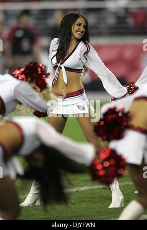 An Arizona Cardinals cheerleader performs in a Halloween costume