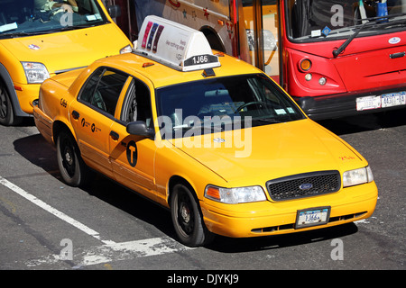 Yellow taxi cabs driving in the street, New York. America Stock Photo
