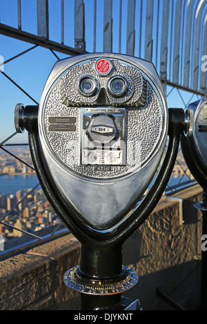 New York Manhattan city skyline and tower viewer telescope binoculars on the Empire State Building observatory viewing deck, New Stock Photo