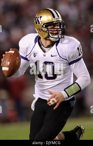 Dec. 4, 2010 - Pullman, Washington, United States of America - Washington Huskies quarterback Jake Locker (10) looks for an open receiver during the game between Washington State and the University of Washington at Martin Stadium in Pullman, WA. Washington leads Washington State 14-7 at halftime. (Credit Image: © Steven Bisig/Southcreek Global/ZUMAPRESS.com) Stock Photo