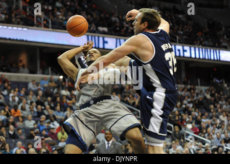 Dec. 4, 2010 - Washington, District of Columbia, United States of America - Georgetown Hoyas guard Chris Wright (4) is fouled by Utah State Aggies forward Nate Bendall (35) during the second half at Verizon Center. Georgetown Hoyas defeated Utah State Aggies 68-51  (Credit Image: © Carlos Suanes/Southcreek Global/ZUMAPRESS.com) Stock Photo